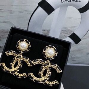CHANEL Elegant Gold and Black Earrings with Pearls